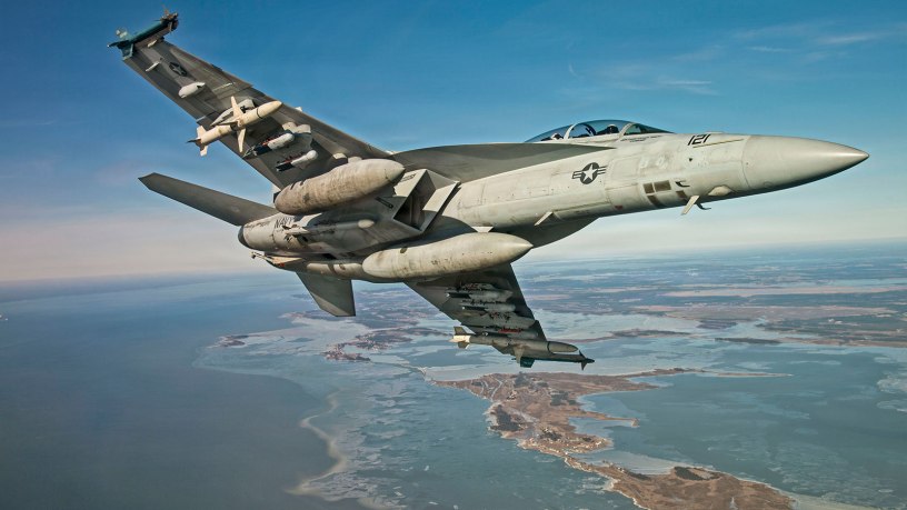 An F/A-18 conducts testing with the Small Diameter Bomb (SDB) II at Naval Air Station Patuxent River, Md. The SDB II variant includes an advanced tri-mode seeker, allowing it to engage dynamic targets in adverse conditions. (U.S. Navy photo)