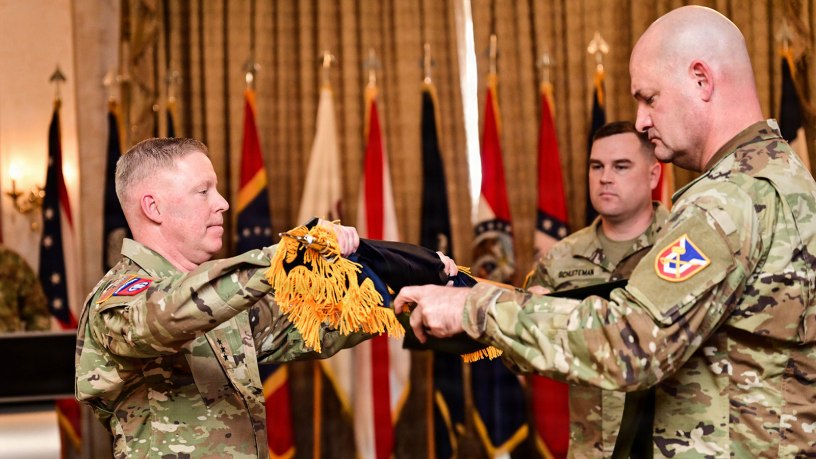 Lt. Gen. Michael McCurry, commanding general, Futures and Concepts Command, and Command Sergeant Major William Justice, command sergeant major, Futures and Concepts Command, unfurl the colors at the Futures and Concepts Command activation ceremony. (U.S. Army Photo by Jean Wines.)