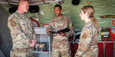 Capt. Darian Cornelius, 434th Air Refueling Wing chaplain, officiates the wedding of Master Sgt. Bryon Snead and Staff Sgt. Lynsey Chlebana, both 434th Aircraft Maintenance Squadron crew chiefs, aboard a KC-135R Stratotanker at Grissom Air Reserve Base, Ind., Feb. 17, 2026. Grissom is the largest KC-135 unit in Air Force Reserve Command with 16 tankers. (U.S. Air Force photo by Benjamin Mota)