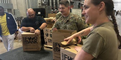 U.S. Army Reserve Sgt. Lawrence Hoppman, Sgt. Christopher Heinneman and Sgt. 1st Class Jessica Forester of the 205th Theater Public Affairs Support Element finish packaging completed donation boxes at the San Antonio Food Bank. Feb. 20, 2026. The Soldiers of the 205th are committed to building strong partnerships with the local community. (U.S. Army Reserve photo by Spc. Collin Bertagnoli)
