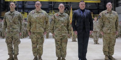 Five of six New York Army National Guard Soldiers who received French medal in recognition of the aid they offered to French special operations forces in August 2023, stand in formation during an award ceremony in Rochester, New York, Feb. 22, 2026. The Soldiers were awarded the French National Defense Gold Medal with Bronze Star by Maj. Gen. Michel Natali, the assistant adjutant general for Army. Pictured are, from left, Staff Sgt. Jedediah Estrada, Staff Sgt. Samuel Sacco, Chief Warrant Officer 2 Jared Twigg, Retired Chief Warrant Officer 3 Aaron Taylor, and Chief Warrant Officer 4 Christopher Scott. Not pictured is Sgt. Zachary Albright who was attending a school. (U.S. Army photo by Sgt. Jean Sanon)