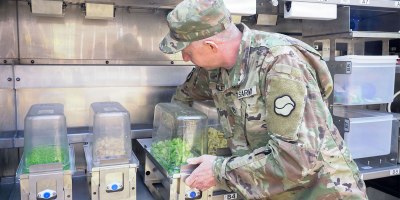 U.S. Army Staff Sgt. Darren Bailey, noncommissioned officer in charge of Market 19, 19th Expeditionary Sustainment Command, loads ingredients into the Sustained Autonomous Meals system at Camp Walker, Daegu, Republic of Korea, Mar. 26, 2026. The system allows a small team to support large formations by streamlining food preparation and increasing output through automation. (U.S. Army photo by Sgt. Deziree Keay)