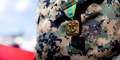 U.S. Marines and Sailors are awarded with Navy and Marine Corps Achievement Medals and Letters of Appreciation at Camp Schwab, Okinawa, Japan, Oct. 11, 2024. The Marines and Sailors were awarded for their heroic actions in providing aid to a Japanese local after a vehicle accident in Okinawa, Japan. The Marines are with 4th Marine Regiment, 3d Marine Division. (U.S. Marine Corps photo by Cpl. Michael Taggart)
