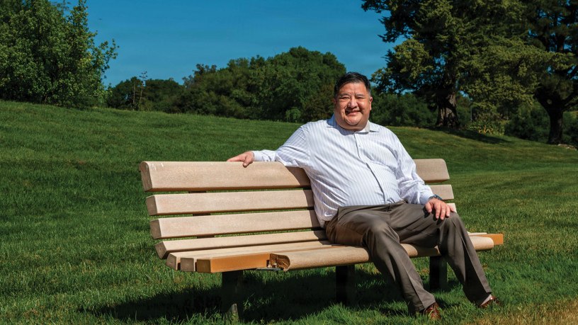 David Lin, 60th Civil Engineer Squadron deputy base civil engineer, sits outdoors at Travis Air Force Base, California, March 25, 2026. Lin received a lifesaving kidney transplant in December 2025, facilitated by his close friend Amy Larson, enabling him to return to duty as a member of Team Travis. (U.S.) Air Force Photo by Gary Edwards)