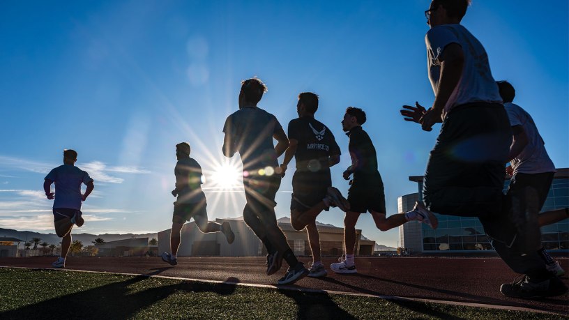 Airmen and special warfare recruits participate in physical training during Exercise Bolt and Dagger at Nellis Air Force Base, Nev., Dec. 16, 2025. The three-day exercise incorporates physical fitness as one of several foundational components that prepare Airmen for the demands of the Tactical Air Control Party mission and overall readiness. (U.S. Air Force photo by William R. Lewis)