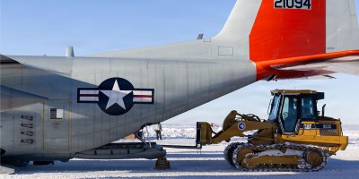 A LC-130 Hercules from the 109th Airlift Wing is loaded with cargo at Williams Field, Antarctica, Dec. 22, 2025. The ski-equipped cargo aircraft supports Operation Deep Freeze, the Department of War’s annual mission to provide logistical support to the National Science Foundation in Antarctica. (U.S. Air National Guard photo by Tech. Sgt. Gabriel Enders)