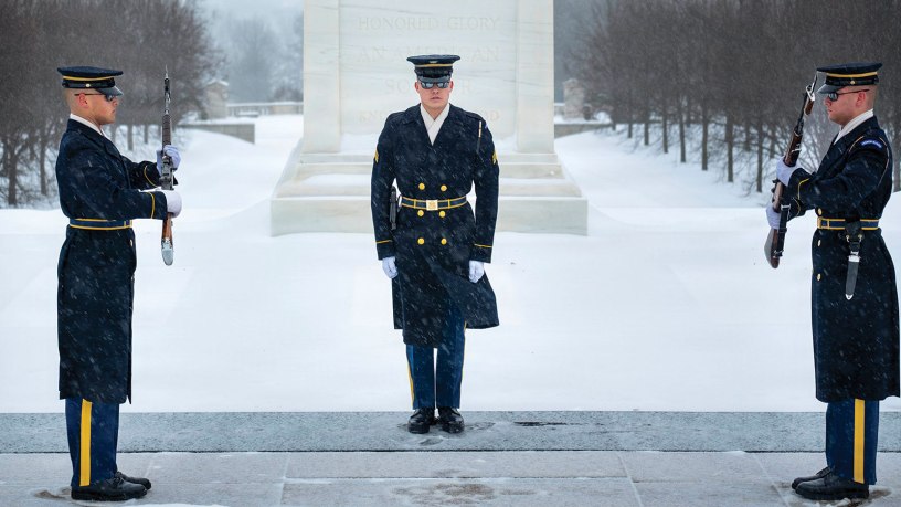 Army Pvt. Alijah Leach, left, Army Sgt. Gabriel Sudharto, center, and Army Pfc. Austin Goodwin, tomb sentinels assigned to the 3rd Infantry Regiment, pass orders during the changing of the guard at the Tomb of the Unknown Soldier at Arlington National Cemetery, Va., Jan. 25, 2026.