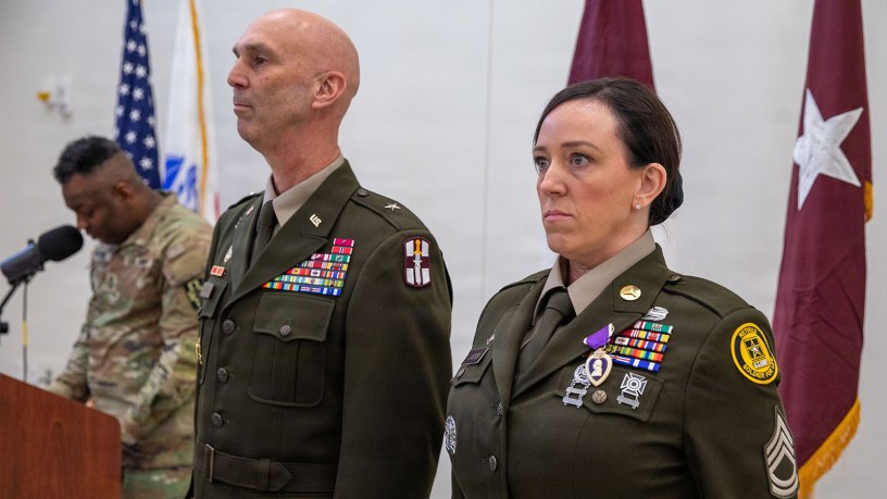 Brig. Gen. Todd Traver, deputy commanding general of the 807th Theater Medical Command, presents the Purple Heart to retired U.S. Army Reserve Sgt. 1st Class Christina Larson during her retirement ceremony at Fort Sheridan, Illinois, Feb. 20, 2026. Larson received the award for wounds sustained during a 2015 deployment to Afghanistan. (U.S. Army Reserve photo by Staff Sgt. Mikayla Fritz)