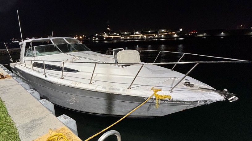 A suspected drug smuggling vessel tied to the pier following an interdiction by the crew of the Coast Guard Cutter Richard Etheridge 8 miles off Miami, Florida, Feb. 21, 2026. The Etheridge’s crew seized approximately 17 pounds of marijuana and 174 pounds of cocaine found aboard the vessel. (U.S. Coast Guard photo)