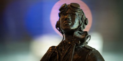 A statue sits static at new Tuskegee Airmen exhibit at the Virginia Air and Space Science Center in Hampton, Virginia, March 26, 2026. The statue was made by Tuskegee Airman Lt. Col. (retired) Clarence L. Shivers and was commissioned in 1985 for display at the U.S. Air Force Academy. (U.S. Air Force photo by Staff Sgt. Michael Bowman)