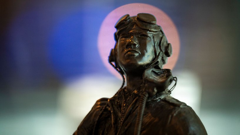 A statue sits static at new Tuskegee Airmen exhibit at the Virginia Air and Space Science Center in Hampton, Virginia, March 26, 2026. The statue was made by Tuskegee Airman Lt. Col. (retired) Clarence L. Shivers and was commissioned in 1985 for display at the U.S. Air Force Academy. (U.S. Air Force photo by Staff Sgt. Michael Bowman)