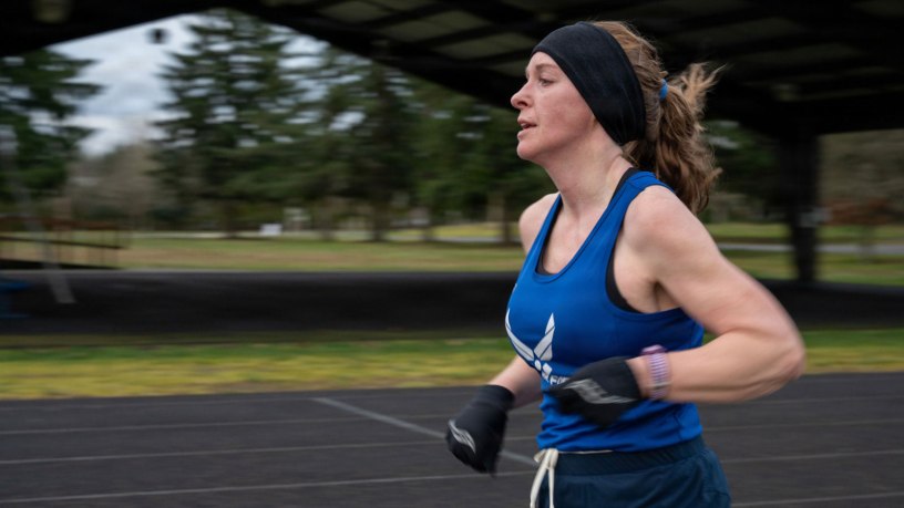 Air Force Senior Master Sgt. Tiffany Hallmark, 446th Force Support Squadron chief of cyber operations, runs on the track at Joint Base Lewis-McChord, Wash., Feb. 27, 2026.
