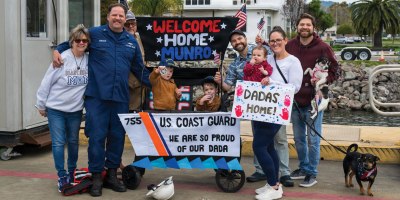 Coast Guard Chief Petty Officer Joseph Gonzalez, a crew member aboard the Coast Guard cutter Munro, is greeted by his family during the cutter's return to its home port in Alameda, Calif., March 1, 2026. The crew returned following a historic multimission deployment spanning more than 26,000 miles from the Eastern Pacific Ocean to the Northern Atlantic.