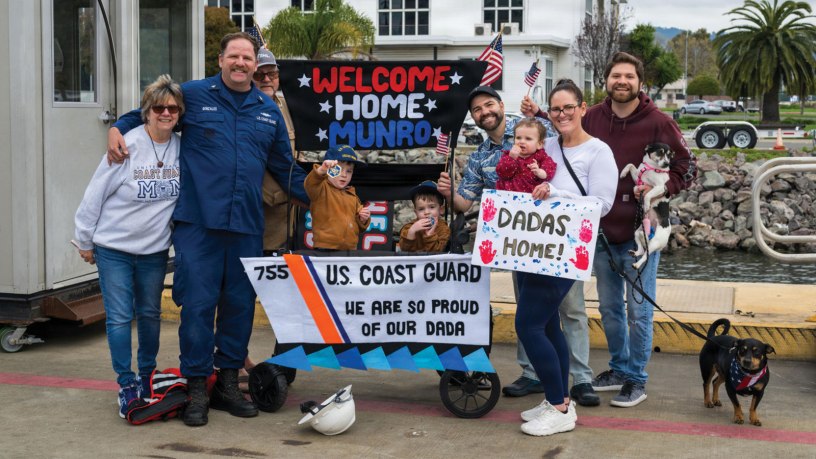 Coast Guard Chief Petty Officer Joseph Gonzalez, a crew member aboard the Coast Guard cutter Munro, is greeted by his family during the cutter's return to its home port in Alameda, Calif., March 1, 2026. The crew returned following a historic multimission deployment spanning more than 26,000 miles from the Eastern Pacific Ocean to the Northern Atlantic.
