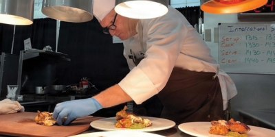 Chief Warrant Officer 4 Colby Beard, 807th Theater Medical Command, plates a dish during the live cooking portion of the Joint Culinary Training Exercise at Fort Gregg-Adams, Virginia, Feb. 27–March 4, 2026. Beard competed in the international challenge, preparing a poultry-based entrée under timed conditions against international military teams.