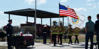 Members from the Louis F. Garland Fire Academy Joint Service Fire Guard present the Colors during the opening of the DoW Fallen Firefighter Memorial, Goodfellow Air Force Base, Texas, Mar. 6, 2026. The Fire Guard presented the colors, lowered the U.S. and Military Firefighter Heritage Foundation flags to half-staff and placed roses at the memorial site. (U.S. Air Force photo by Senior Airman Brian Lummus)