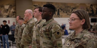 Soldiers assigned to the 145th Mobile Public Affairs Detachment stand at attention during their welcome home ceremony held at the Armed Forces Reserve Center in Mustang, Oklahoma on March 7, 2026. The Soldiers deployed in support of U.S. Special Operations Command Europe, executing over 35 missions that showcased the specialized training of U.S. and allied special operations forces. (Oklahoma National Guard photo by Sgt. Cambrie Cannon)