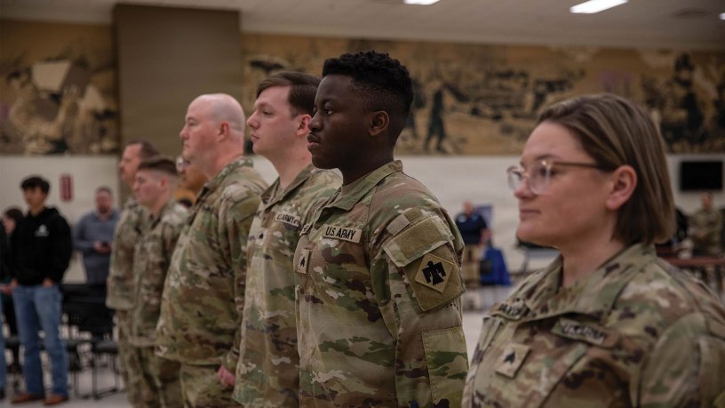 Soldiers assigned to the 145th Mobile Public Affairs Detachment stand at attention during their welcome home ceremony held at the Armed Forces Reserve Center in Mustang, Oklahoma on March 7, 2026. The Soldiers deployed in support of U.S. Special Operations Command Europe, executing over 35 missions that showcased the specialized training of U.S. and allied special operations forces. (Oklahoma National Guard photo by Sgt. Cambrie Cannon)