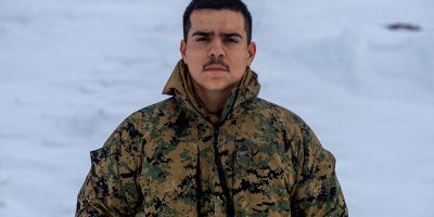 U.S. Marine Corps Cpl. Christopher Duran, an automotive maintenance technician with Combat Logistics Regiment 453, 4th Marine Logistics Group, poses for a portrait photo at Fort Greely, Alaska, March 8, 2025. Duran provided Marine Forces Reserve Communication Strategy and Operations Marines with an interview to participate in a feature story. (U.S. Marine Corps photo by Sgt. Aaron Torreslemus)