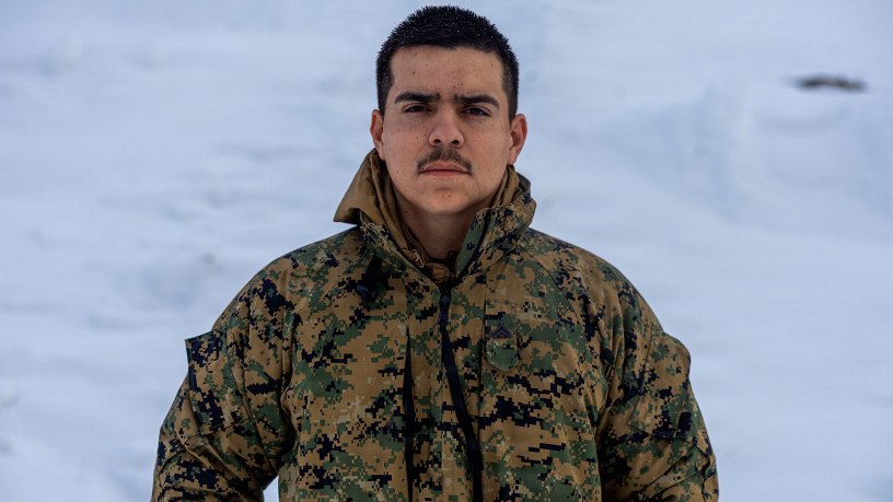 U.S. Marine Corps Cpl. Christopher Duran, an automotive maintenance technician with Combat Logistics Regiment 453, 4th Marine Logistics Group, poses for a portrait photo at Fort Greely, Alaska, March 8, 2025. Duran provided Marine Forces Reserve Communication Strategy and Operations Marines with an interview to participate in a feature story. (U.S. Marine Corps photo by Sgt. Aaron Torreslemus)
