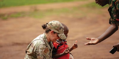 U.S. Air Force Lt. Col. Angela Ling, the lead medical readiness exercise planner for Justified Accord 26 with the 155th Medical Group, 155th Air Refueling Wing, Nebraska Air National Guard, introduces herself to a Tanzanian patient as part of a medical readiness exercise during JA26 at Msata Military Training Base in Msata, Tanzania, March 9, 2026.