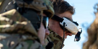 A U.S. Army Soldier with the 101st Airborne Division (Air Assault) operates an unmanned aircraft system (UAS) via a headset during a live-fire exercise at Fort Campbell, KY, March 12. The exercise was designed to test the integration of UAS to support ground forces. (U.S. Army photo by Spc. Sandy Vera)