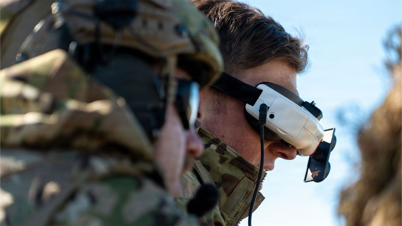 A U.S. Army Soldier with the 101st Airborne Division (Air Assault) operates an unmanned aircraft system (UAS) via a headset during a live-fire exercise at Fort Campbell, KY, March 12. The exercise was designed to test the integration of UAS to support ground forces. (U.S. Army photo by Spc. Sandy Vera)