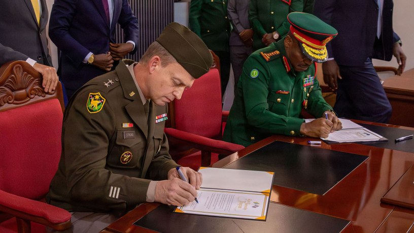 U.S. Army Maj. Gen. Craig Strong, left, Nebraska’s adjutant general, and Gen. Jacob John Mkunda, chief of defense forces for the Tanzania Peoples’ Defence Forces, sign a formal letter of intent in Dar es Salaam, Tanzania, March 12, 2026. The agreement officially links the Nebraska National Guard and Tanzania through the National Guard Bureau’s State Partnership Program. Photo by Staff Sgt. Gauret Stearns.