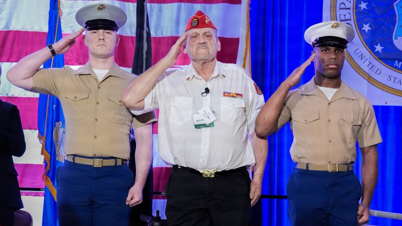 Wayne L. Miller, USMC Vietnam Veteran, sang The Star Spangled Banner and Lee Greenwood's "Proud to be an American," during the Welcome Home Vietnam Veterans ceremony Sunday, March 22 in Baltimore, Maryland. Miller is falnked by two Marines from Marine Barracks, 8th & I, Washington D.C.
