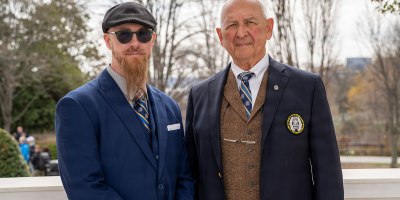 Richard A. Azzaro (Badge No. 19), founding member of the Society of the Honor Guard - Tomb of the Unknown Soldier and Joseph Hull (Badge No. 568), Commemorative Chair for the Society of the Honor Guard - Tomb of the Unknown Soldier pose for a photo following a ceremony honoring 100 years of a U.S. Army Soldier guarding the Tomb at Arlington National Cemetery, Va., March 25, 2026.