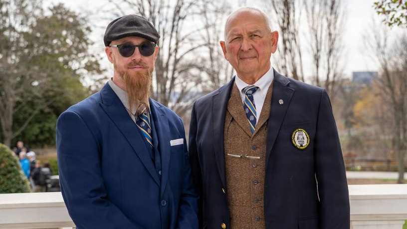Richard A. Azzaro (Badge No. 19), founding member of the Society of the Honor Guard - Tomb of the Unknown Soldier and Joseph Hull (Badge No. 568), Commemorative Chair for the Society of the Honor Guard - Tomb of the Unknown Soldier pose for a photo following a ceremony honoring 100 years of a U.S. Army Soldier guarding the Tomb at Arlington National Cemetery, Va., March 25, 2026.