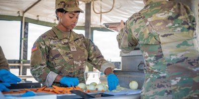U.S. Army Pfc. Jajleah Harris, a culinary specialist with the 1109th Theater Aviation Support Maintenance Group, chops onions during the Connecticut National Guard's third annual Warrior Chef Competition Feb. 28, 2026, at Camp Nett, Niantic, Connecticut. The Warrior Chef Competition was a culminating event for a statewide 92G training event, here.