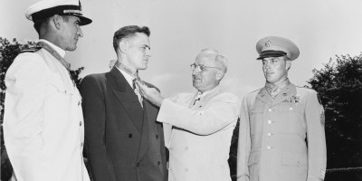 President Harry S. Truman, center right, presents the Medal of Honor to three former servicemen during a White House ceremony, June 25, 1948. From left to right, the recipients are Navy Lt. Cmdr. Jackson Pharris, Navy Petty Officer 1st Class Francis J. Pierce and Army Staff Sgt. John R. Crews.