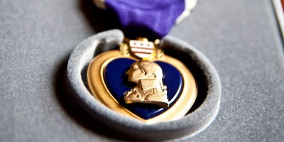 Sgt. 1st Class Paul M. Dimond received the Purple Heart Medal March 28, 2014, for injuries he sustained from an improvised explosive device which was detonated five meters from him during a graduation ceremony at the Afghan National Army 205th Corps Training Center Dec. 8, 2011. The Purple Heart is one of the oldest commendations in American military history, dating back to the later years of the Revolutionary War and was originally designed as the Badge of Military Merit.