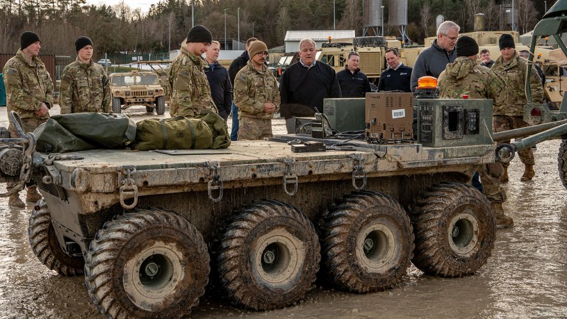 Soldiers of the Lethal Unmanned Systems Platoon, Strike Company, 2nd Battalion, 2nd Infantry Regiment, 3rd Brigade, 10th Mountain Division, speak to Army civilians from the U.S. Army Program Executive Office Combat Support & Combat Service Support about the Small Multipurpose Equipment Transport before Exercise Combined Resolve 25-1 at the Joint Multinational Readiness Center on Hohenfels Training Area, Germany, Jan. 24, 2025.