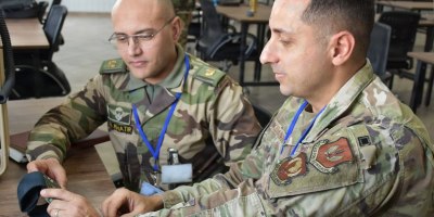U.S. Air Force Master Sgt. Babak Kermanshahi (right), a communications theater operations planner assigned to Headquarters U.S. Air Forces in Europe – Air Forces Africa, and a member of the Royal Armed Forces of Morocco connect to a U.S. Link 16 network on using Moroccan computer equipment ahead of African Lion 2026 (AL26) at Agadir, Morocco, Feb. 3, 2026.