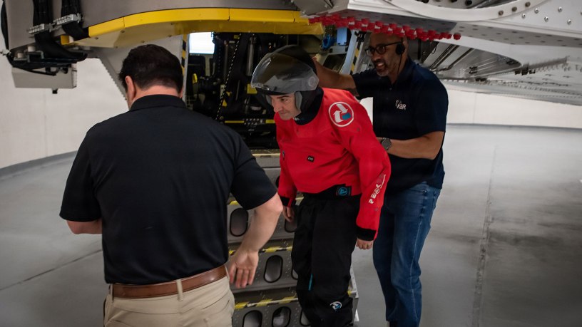 John Trentini, left, a NASA flight surgeon, and Andre Scott, right, an operations technician assigned to Wright-Patterson Air Force Base, Ohio, assist NASA astronaut Jack Hathaway as he exits the Air Force Research Laboratory's 711th Human Performance Wing's centrifuge, June 20, 2025. Hathaway was one of five astronauts from NASA, the Canadian Space Agency and the European Space Agency who completed centrifuge training, which simulates the gravitational forces experienced during launch and reentry.
