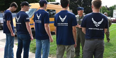 Brig. Gen. Craig McPike, Air Force Recruiting Service deputy commander, speaks with future recruits at the Register’s Annual Great Bicycle Ride Across Iowa in Orange City, Iowa, July 19, 2025. Deliberate recruiting has allowed the Air Force and Space Force to meet their fiscal year recruiting goals, and obtain the largest delayed entry program in recent history. (U.S. Air Force photo by Staff Sgt. Jessica Montano)