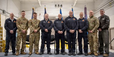 Eight firefighters from the 123rd Fire and Emergency Services Department are honored with Kentucky Distinguished Service Medals during a ceremony at the Kentucky Air National Guard Base in Louisville, Ky., Dec. 14, 2026, for their efforts in subduing a massive fire after a United Parcel Service cargo jet crashed near Louisville Muhammad Ali International Airport in November.