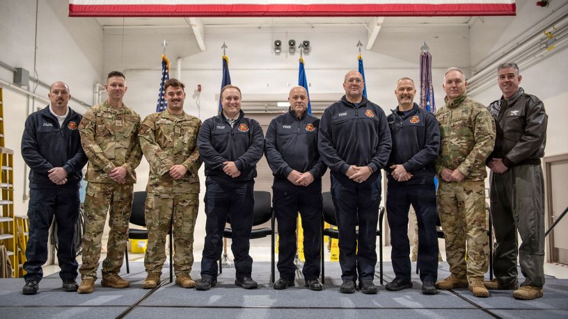 Eight firefighters from the 123rd Fire and Emergency Services Department are honored with Kentucky Distinguished Service Medals during a ceremony at the Kentucky Air National Guard Base in Louisville, Ky., Dec. 14, 2026, for their efforts in subduing a massive fire after a United Parcel Service cargo jet crashed near Louisville Muhammad Ali International Airport in November.