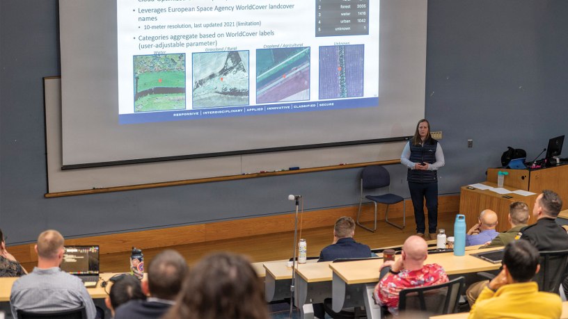 Commencement speaker Rear Adm. Michael S. Mattis, director of strategic effects for U.S. Naval Forces Europe and Africa and commander, Task Force 66, celebrates the latest class of Naval Postgraduate School graduates during the Summer With synthetic battlefield emissions data provided by NATO, a team of four Naval Postgraduate School (NPS) midcareer officer scholars developed a proof-of-concept analytic interface for operators and analysts to help uncover the sources of these emissions. (U.S. Navy photo by Mass Communication Specialist 2nd Class Janiel Adames)