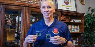 U.S. Air Force Brig. Gen. (Ret.) Fran Hendricks holds original sewn prototypes of the Military Freefall Parachutist Badge during an interview at Eglin Air Force Base, Florida. Tasked in 1993 by U.S. Special Operations Command leadership, Hendricks helped lead the effort to design and establish the badge, which was officially approved for wear in 1994 to recognize military personnel qualified in high-altitude freefall operations. (U.S. Army photo by Sgt. Jacob Bradford)