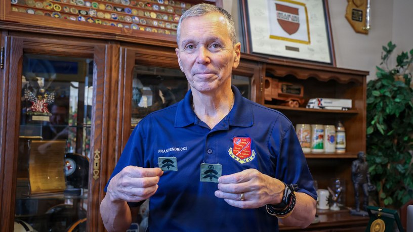 U.S. Air Force Brig. Gen. (Ret.) Fran Hendricks holds original sewn prototypes of the Military Freefall Parachutist Badge during an interview at Eglin Air Force Base, Florida. Tasked in 1993 by U.S. Special Operations Command leadership, Hendricks helped lead the effort to design and establish the badge, which was officially approved for wear in 1994 to recognize military personnel qualified in high-altitude freefall operations. (U.S. Army photo by Sgt. Jacob Bradford)