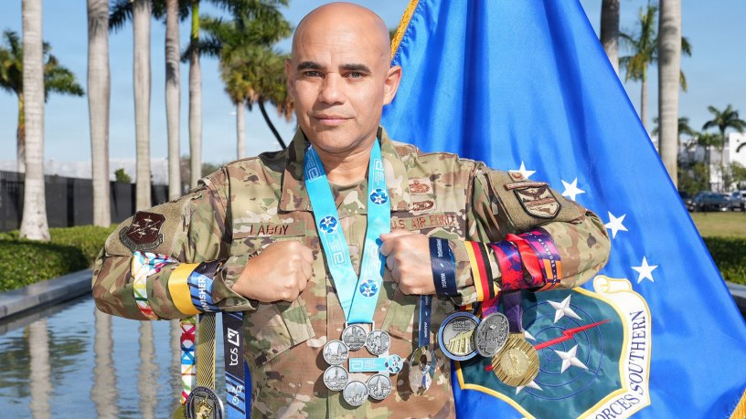 U.S. Air Force Col. Alfredo “Juny” Laboy poses with his World Marathon Majors medals outside U.S. Southern Command headquarters in Miami, Feb. 24, 2026. Laboy became the first active-duty service member to complete all seven World Marathon Majors within a single calendar year, marking a rare endurance achievement across the global race series. (Courtesy photo)