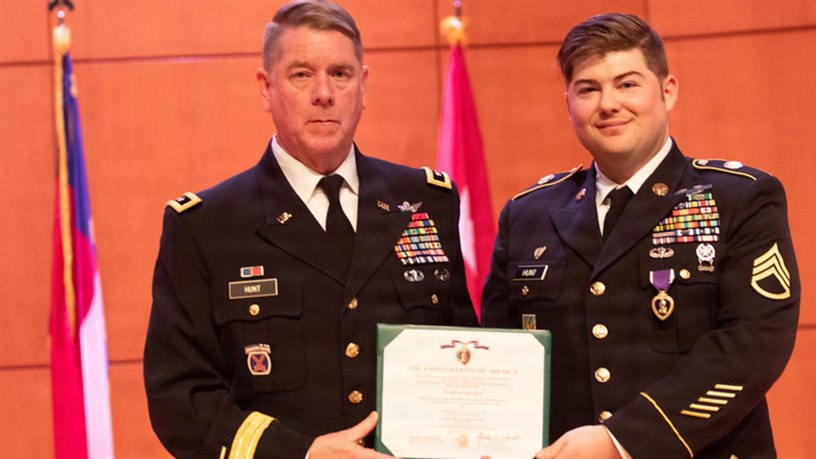 Maj. Gen. Todd Hunt (Left), NC Adjutant General present U.S. Army Staff Sgt. David Hunt (right), 130th Military History Detachment, the Purple Heart at Joint Force Headquarters in Raleigh, NC on March 6, 2026. The Purple Heart is the oldest military award still presented to American service members of the armed forces who have been wounded or killed in the line of duty. (U.S. Army National Guard Photo by Sgt. Brittany)