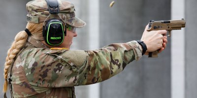 U.S. Army National Guard Spc. Jenna Berry of 1st Battalion, 135th Aviation Regiment, 35th Combat Aviation Brigade, 35th Infantry Division, fires the M17 pistol down range during the pistol grouping event at the 2026 Missouri Army National Guard Best Warrior Competition at Camp Clark, Missouri, March 6, 2026. Participants in the competition complete physical and mental challenges to determine the best soldiers to represent Missouri in the upcoming regional competition. (U.S. Army National Guard photo by Sgt. Kevin Norton)