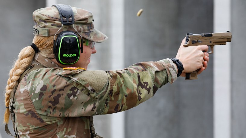U.S. Army National Guard Spc. Jenna Berry of 1st Battalion, 135th Aviation Regiment, 35th Combat Aviation Brigade, 35th Infantry Division, fires the M17 pistol down range during the pistol grouping event at the 2026 Missouri Army National Guard Best Warrior Competition at Camp Clark, Missouri, March 6, 2026. Participants in the competition complete physical and mental challenges to determine the best soldiers to represent Missouri in the upcoming regional competition. (U.S. Army National Guard photo by Sgt. Kevin Norton)