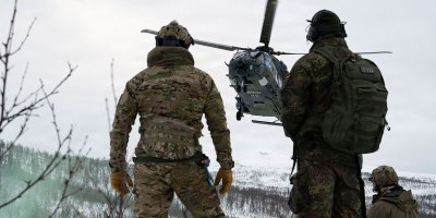 A U.S. Air Force Airman assigned to the 57th Rescue Squadron based out of Aviano Air Base, Italy, and a German army air corps pilot assigned to the 30 Transport Helicopter Regiment based out of Niederstetten Air Base, Germany, watch an NHIndustries NH90 arrive on scene at a combat search and rescue scenario during Exercise Cold Response 26 in Norway, March 19, 2026.