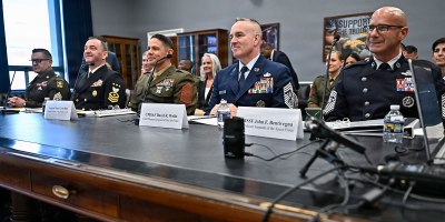Chief Master Sgt. of the Space Force John Bentivegna, right, Chief Master Sgt. of the Air Force David Wolfe, second from right, Sgt. Maj. of the Marine Corps Carlos Ruiz, Master Chief Petty Officer of the Navy John Perryman and Sgt. Maj. of the Army Michael Weimer listen to opening remarks during a House Appropriations Subcommittee hearing about military quality of life, on Capitol Hill in Washington, D.C., March 25, 2026. (U.S. Air Force photo by Eric Dietrich)