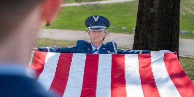 U.S. Air Force Senior Master Sgt. Karen Mitchell, member of the Missouri Military Funeral Honors Program, Missouri Air National Guard, prepares to fold a ceremonial flag, March 26, 2026, in St. Louis. Mitchell has served 42 years in the Missouri Air National Guard. (U.S. Air National Guard photo by Master Sgt. Stephanie Mundwiller)